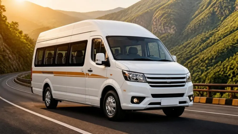 Illustration of a white 12-seater tempo traveller on a hill road at sunset